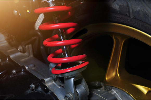 A suspension coil fitted on a car